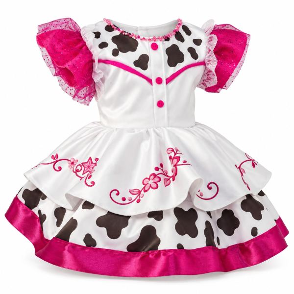 Vestido infantil de vaquita blanco con manchas negras, mangas fucsia con tul brillante, bordados fucsia y falda con volantes y ribete satinado fucsia.